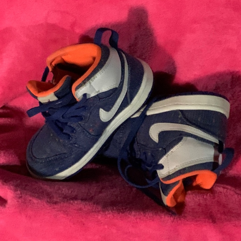 Air Jordan’s blue white orange with multi color speckles in the blue.